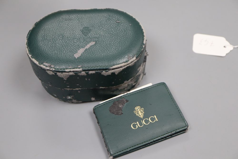 A ladys modern stainless steel and yellow metal Gucci quartz wrist watch, with original receipt and box(a.f.).